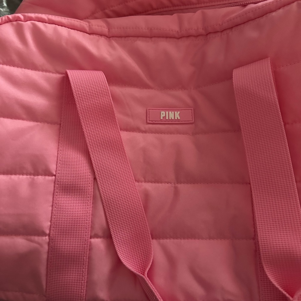 Victoria’s Secret pink duffel bag.